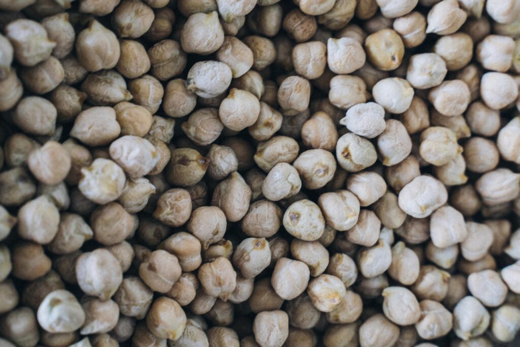 Detailed texture view of organic chickpeas, highlighting natural abundance and nutrition.